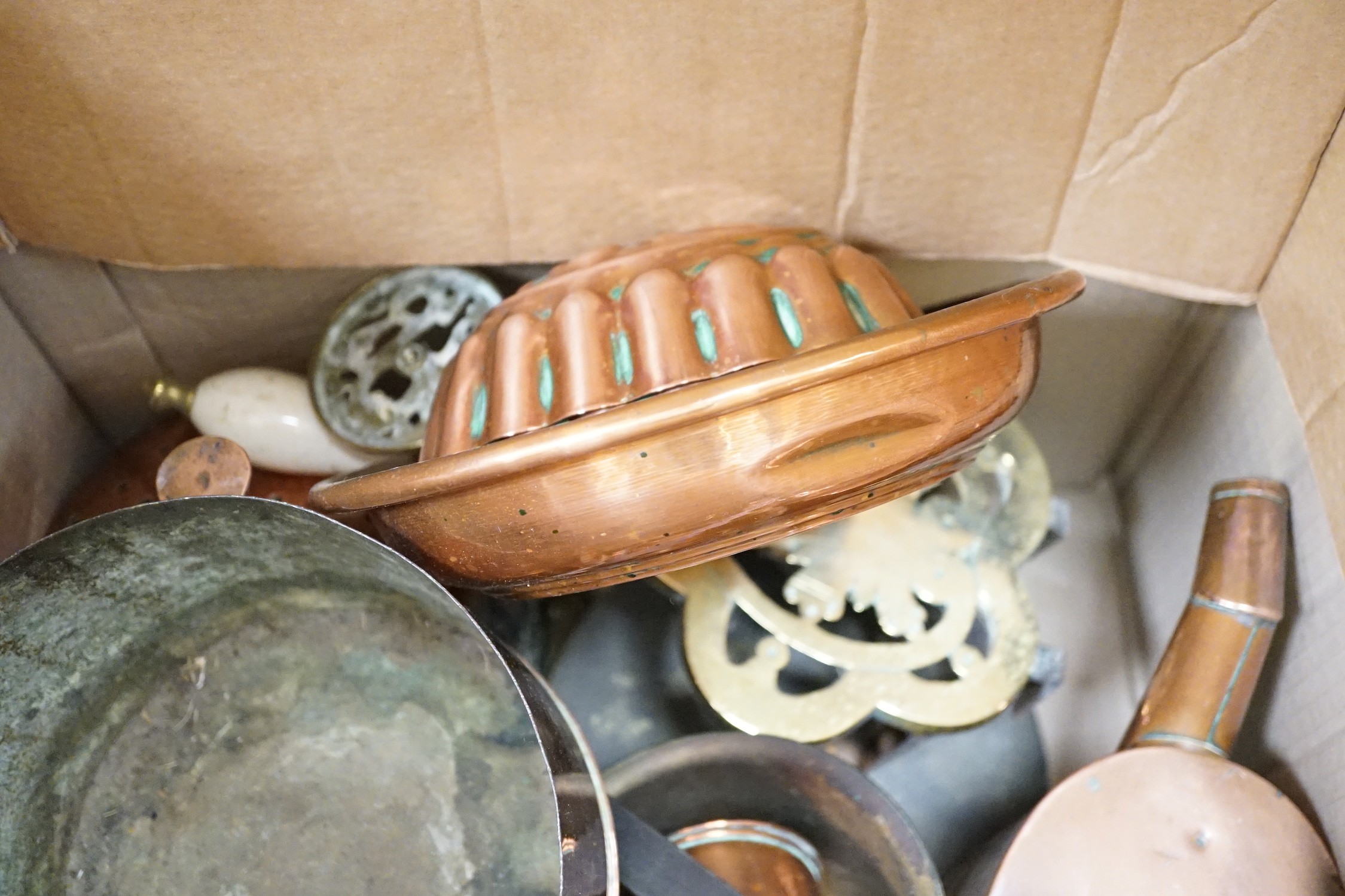A quantity of various copper and brass to include jelly moulds, trivets, watering cans etc.